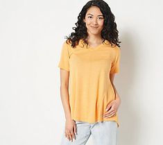 This swingy short-sleeve top is your new go-to for easy-going days spent strolling through town. Pair it with leggings, jeans, or even sweats for a casually chic look. From LOGO by Lori Goldstein®. Casual Stretch V-neck Top With Short Sleeves, Casual V-neck Top With Short Sleeves And Stretch, Relaxed Fit V-neck Top With Short Sleeves, Stretch Solid V-neck Top With Short Sleeves, Solid Color Short Sleeve V-neck Top For Spring, Spring V-neck Top With Short Sleeves, Relaxed Fit Short Sleeve V-neck Top For Summer, Casually Chic, Lori Goldstein