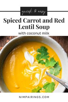 a bowl filled with carrot and red lentil soup on top of a wooden table