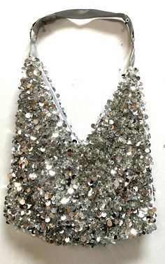 This cool purse is fully sequin beaded front & back tip to tip. Perfect for pairing up with your costume or to carry with you in event! Glamorous Party Bags With Sequins, Glamorous Sequin Party Bags, Sequin Bags For Night Out And Party Season, Glamorous Sequin Bag For Night Out, Silver Beaded Sequin Fabric For Party, Beaded Sequin Fabric For Party, Summer Party Embellished Bags, Embellished Party Bags For Summer, Silver Party Bag For Summer