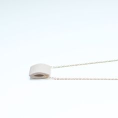 In stock & ready to ship. Individually handcrafted, sculptural, pigmented porcelain pendant on a 16 inch, 14k gold fill chain. GRAMMAR pieces are designed to be minimal, so that you'll wear them often and easily, making them a staple in your wardrobe. Individually artist-handcrafted, durable & natural material. 22 inch, 14 karat gold fill chain. Ceramic pendant is approximately 1/2" wide. Small batch, energy conscious production. Lifetime repair, replacement and service options. Create a set wit Minimalist Cable Chain Necklaces For Everyday Use, Minimalist Cable Chain Necklace For Everyday Use, Everyday White Rectangular Pendant Necklace, White Modern Necklace With Adjustable Chain, Everyday White Necklace With Adjustable Chain, White Necklace With Adjustable Chain For Everyday, Modern White Necklaces For Everyday, Minimalist Everyday Beige Jewelry, Everyday Minimalist Beige Jewelry