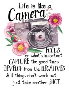 a camera with flowers on it that says life is like a camera