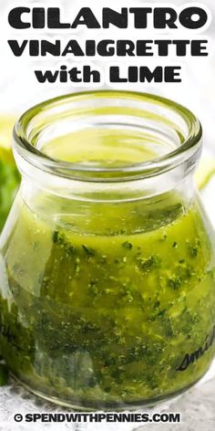 a jar filled with cilantro vinagrete and lime