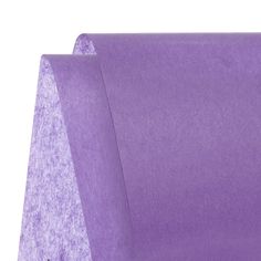 a close up of a purple paper on a white background