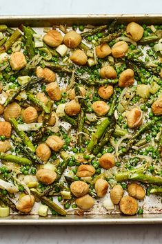 asparagus and chickpeas on a baking sheet