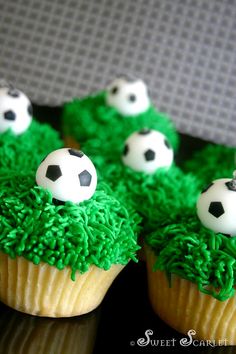 cupcakes decorated with green frosting and soccer balls