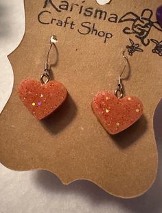 Orange  glitter heart drop earrings for Valentine's Day Handmade from epoxy resin with nickel and lead free hardware findings I can also turn these into clips if needed. I do sell in craft shows. If I by chance sell an item listed I will  message you and match it as close as I can it may just take a few more days.  All jewelry is lead and nickel free findings from Hobby Lobby Brand - Jewelry Shoppe Galentines Day, Orange Glitter, Heart Drop Earrings, Glitter Hearts, Brand Jewelry, Drop Earring, Valentine Gift, Hobby Lobby, Heart Earrings