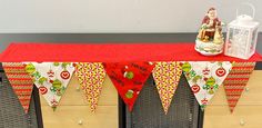 a red table topped with a christmas banner