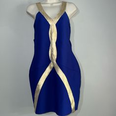 a blue and gold dress is displayed on a mannequin