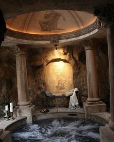 an indoor hot tub is shown in the middle of a room with columns and pillars