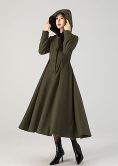 Upgrade your outerwear collection with our army green wool coat, complete with a hood and a single-breasted button closure. The army green is versatile and easy to pair with various outfits.  Details  * 50% wool blend, 50% fiber,nylon * A matching smooth satiny lining * Two standard size side seam pockets * Front Buttons closure  * Long wool coat * Hooded coat * Fit and flare coat * Swing coat * Daily coat * Perfect for autumn winter * Dry clean  * More color choose No 1:  https://etsy.me/4fGTZ6f MODEL SIZE Bust 85 cm(33.4") Waist 67 cm(26.7") Height 168cm (5' 6") She wears size XS Choose CUSTOM Order if you * Need a better fit * Can't find your size in our size Chart * Change the Style * Chang the Length * Your Height is not Between 5'1" - 5"9" * Your weight is over 75 kg SIZE GUIDE Size Khaki Wool Coat With Pockets For Winter, Khaki Long Wool Coat For Fall, Khaki Wool Coat For Work In Winter, Green Wool Coat For Winter, Military Style Pea Coat For Winter Workwear, Winter Wool Pea Coat In Khaki, Khaki Wool Pea Coat For Winter, Olive Military Outerwear For Winter, Olive Winter Outerwear With Buttons