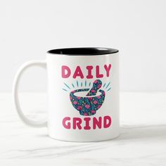 a coffee mug with the words daily grind on it