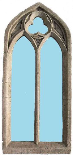 an image of a window that looks like it is made out of stone and has a blue sky in the background