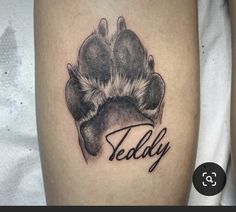 a dog paw with the word teddy on it's left side ribcage