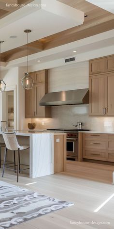 a kitchen with wooden cabinets and white marble counter tops, an island in the middle