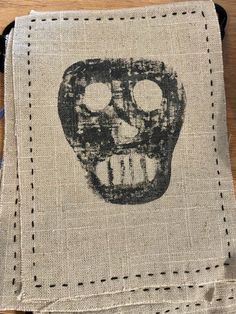 a piece of cloth with a skull drawn on it