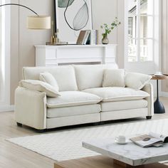 a living room filled with furniture and white walls