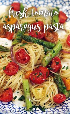 pasta with asparagus and tomatoes on a plate