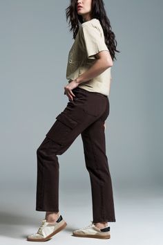 Introducing our Relaxed Cargo Pants in a rich dark brown hue – a versatile and comfortable addition to your wardrobe. These medium-sized cargo jeans come equipped with six pockets, blending style with practicality seamlessly.  The front closure features a zipper and metal button, adding a touch of sophistication to the overall design. With a full length and straight cut, these cargo pants offer a timeless and relaxed look suitable for various occasions.  Crafted for daily wear, these pants are considered a basic essential with their medium sizing, making them perfect for a range of body types. The belt loops provide the option for accessorizing, while the stretch denim ensures both style and flexibility.  The side and back pockets, along with the zip fastening, enhance the functionality of Brown Cargo Pants, Types Of Jeans, Denim Pocket, Knitwear Tops, Cargo Jeans, Wholesale Clothing, Online Womens Clothing, Jeans Fit, Cargo Pants