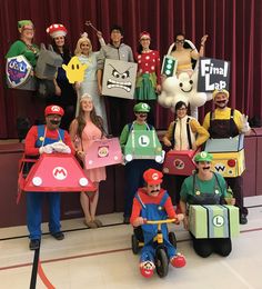 a group of people in costumes posing for a photo