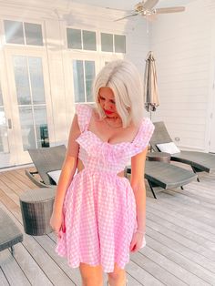 Meet the Life in the Dreamhouse Gingham Dress from Sassy Shortcake! Featuring a classic pink gingham pattern, babydoll silhouette, ruffle sleeves, and side cutouts. Show off your fun, flirty style and add a little sass to your wardrobe! Lined. Also available in blue. fit: runs true to size (model wearing a size small) Cute Ruffled Strap Dresses For Picnic, Gingham Dresses With Ruffles For Picnic, Picnic Gingham Dress With Ruffles, Gingham Dress With Ruffles For Picnic, Gingham Dress With Ruffled Hem And Straps, Plaid Ruffled Dress For Picnic, Gingham Dress With Ruffled Straps And Details, Gingham Dress With Ruffled Straps And Ruffles, Chic Pink Dress For Picnic