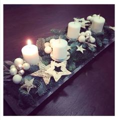 a table with candles and ornaments on it