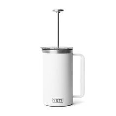 the yeti coffee mug is white and has a handle