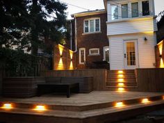 a house with some lights on the steps