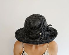 Black Bucket Hat With Short Brim For Beach Season, Black Bucket Hat For Beach Season, Black Bucket Sun Hat For Beach Season, Black Bucket Straw Hat For Beach Season, Elegant Black Hats For Beach Season, Black Brimmed Summer Hat, Black Brimmed Sun Hat For Summer, Black Summer Hat With Curved Brim, Black Summer Hats With Curved Brim