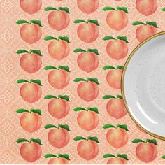 there is a plate with peaches on it next to an orange wallpaper background