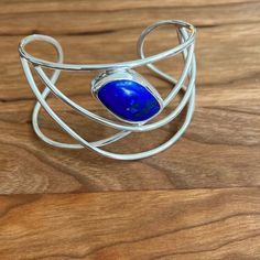 Offers Welcome!! Nwt Sterling Silver .925 Designer Natural 20.4ct Lapis Lazuli Wire Bracelet Bracelet Is 6-1/4” Finest Quality Free-Form 20.4ct Natural Lapis Stone 13.4mm X 24.3mm Designer One-Of-A-Kind Piece 10 Year Guarantee Provided No One Else Has Altered The Piece Certificate Of Authenticity Provided Returns Accepted Within The First 30 Days If You Are Not Completely Satisfied With Your Purchase. J064 Silver Sterling Silver Oval Cuff Bracelet, Silver Lapis Lazuli Jewelry For Formal Occasions, Silver Lapis Lazuli Jewelry For Formal Events, Elegant Blue Sterling Silver Cuff Bracelet, Elegant Oval Sterling Silver Cuff Bracelet, Formal Silver Lapis Lazuli Jewelry, Blue Sterling Silver Cuff Bracelet With Gemstone, Elegant Blue Cuff Bracelet With Polished Finish, Modern Blue Gemstone Bracelets