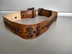 Vintage genuine leather women belt - Genuine leather belt - The belt is adjustable from 74 cm to 81 cm . Width - 4.5 cm For other VINTAGE ACCESSORIES please see here : https://www.etsy.com/shop/TheVINTAGEShopBG?ref=seller-platform-mcnav&section_id=22639651 All pictures are real . You buy exactly what you see in the photos . Thank you for visiting my store. Please check out my other items 😊 Vintage Belts With Antique Buckle, Adjustable, Vintage Leather Adjustable Belt Buckles, Adjustable Vintage Brown Belt With Antique Buckle, Vintage Brown Belt With Antique Buckle And Adjustable Fit, Adjustable Embroidered Leather Belt, Vintage Leather Belts And Suspenders With Matching Belt, Vintage Embroidered Belt For Festival, Vintage Embroidered Festival Belt, Vintage Adjustable Belts For Formal Wear