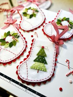 several christmas ornaments are hanging on a table