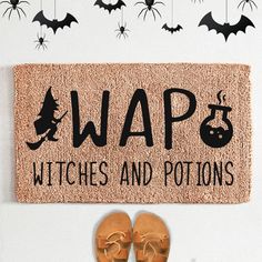 a door mat that says, waps witches and potsions with bats hanging from it