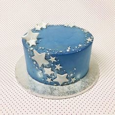 a blue and white cake with stars on it