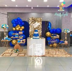 blue and gold birthday party decorations with balloons