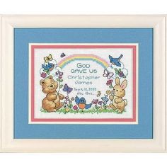 a cross stitch pattern with two teddy bears and butterflies on the border, in a blue frame