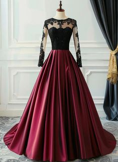 Elegant Burgundy Satin Gown with Black Lace Bodice Black Fitted Satin Ball Gown, Fitted Black Satin Ball Gown, Formal Satin Ball Gown With Sweep Train, Elegant Black Evening Dress With Lace Bodice, Elegant Black Gown With Lace Bodice, Elegant Lace Ball Gown With Sheer Bodice, Elegant Lace Ball Gown For Prom Season, Elegant Lace Ball Gown For Prom, Black Satin Prom Gown