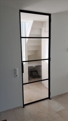 an open glass door in a room