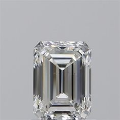 an emerald cut diamond is shown on a white surface with the reflection of it's face