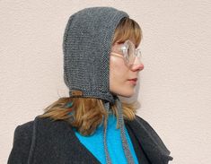 "Gray adult bonnet knitted with 100% pure natural wool. This elegant and warm hood can be your favourite in your wardrobe or it can be a perfect gift idea. Knitted with high quality soft yarns.  Don't forget to check my \"Knit Bonnets\" section where you can find a lot of different color options. 🌿 For more models you can also check my Instagram: @_daldandala_ 🌿 Zero waste: - Reusable and recyclable packaging. - Sustainable material. 🌿 Care: - Hand wash - Cold water - Do not bleach - Do not iron - Do not use drying machine - Do not hang out, let it dry by laying." Packaging Sustainable, Melbourne Winter, Knit Bonnet, Recyclable Packaging, Skull Cap Beanie, Soft Yarn, Skull Cap, Etsy Fashion, Zero Waste