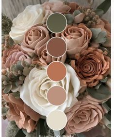 a bouquet with roses and greenery on it is shown in shades of brown, beige, and white