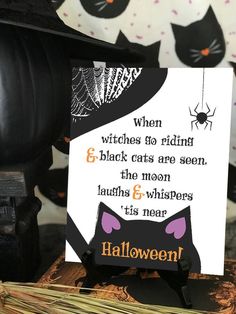 a halloween card with a black cat on it