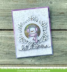 a snowflake card with the words let it snow written in white and purple