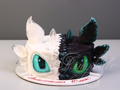 a cake decorated to look like a dragon head