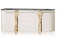 the sideboard is made out of marble and has two doors on each side that are open