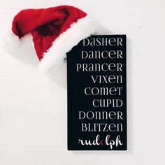 a sign with a santa hat on it that says dasher dancer prancer