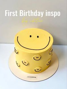 a yellow cake with smiley faces on it