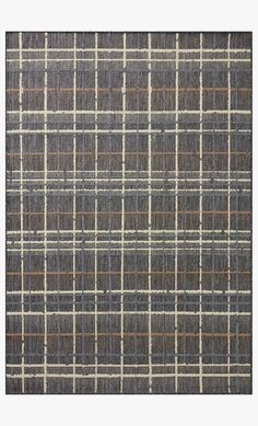 a gray and brown plaid rug with some lines on the ground in front of it