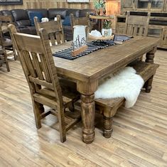 a wooden table and chairs in a room