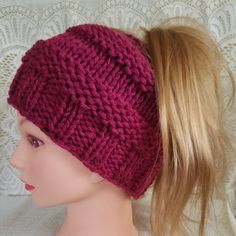 Messy bun hat knitted with a soft, yet warm, cranberry color yarn.  Ideal for joggers or runners.  Very stylish and practical.   Hand knitted. Seamless.  Approximately 7 inches wide and 16 inch circumference. Stretchy..will fit adult, teen, or child.  (NOTE:  My model's head is a little smaller than a child's head, so the hat looks a little bigger than it is)   1 only Care Instructions:  Hand wash in cold & lay flat to dry.  Do not bleach or iron. Punxsutawney Pa, Messy Bun Ponytail, Bun Ponytail, Messy Bun Hat, Bun Hat, Cranberry Color, Ponytail Hat, Head Wrap, Messy Bun